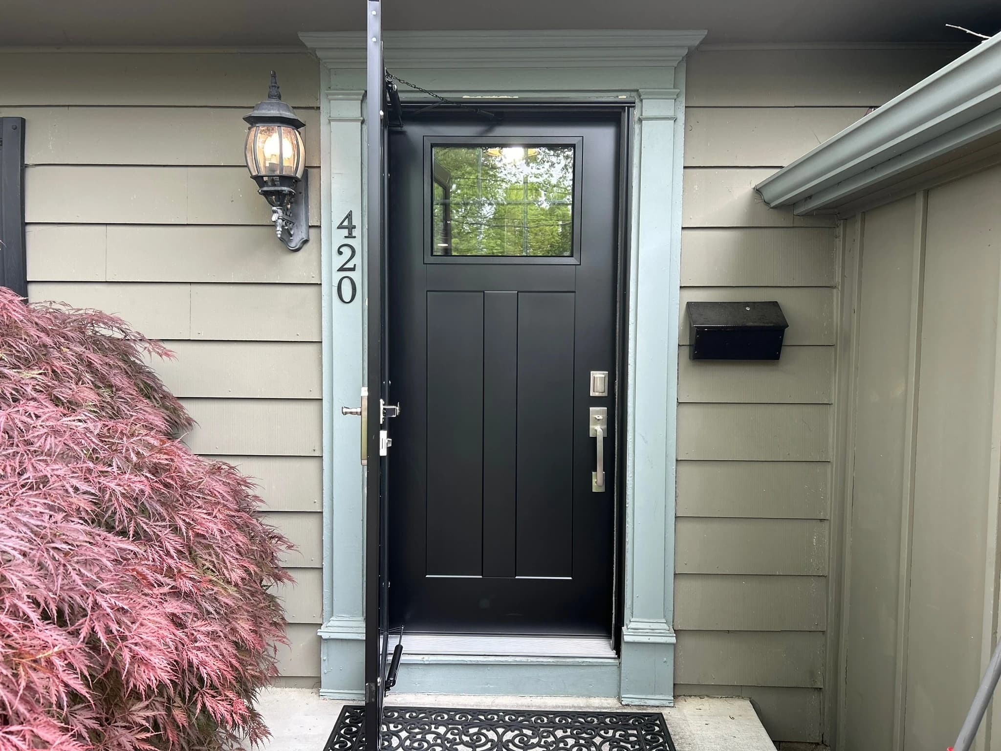 Modern front entry door with sidelights installed in Philadelphia PA by Cosello Construction