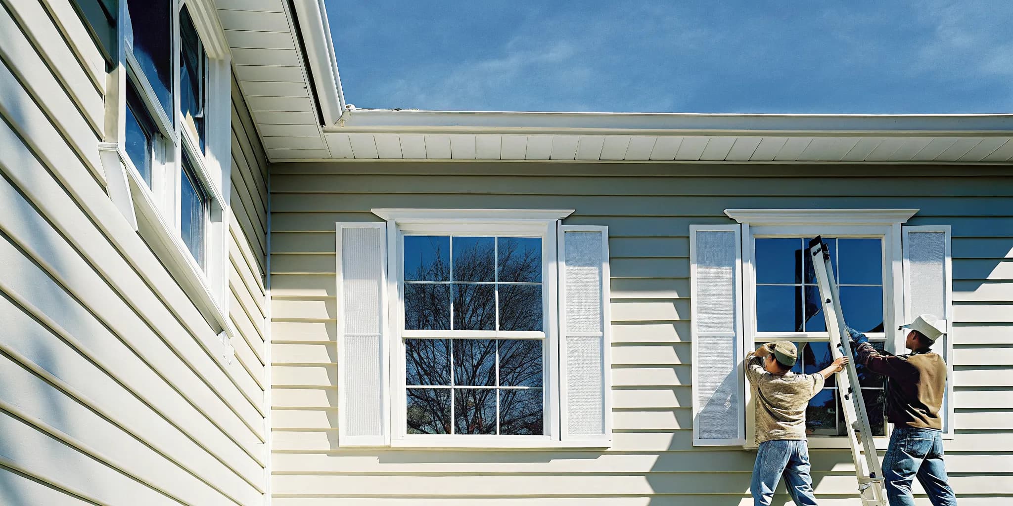 Professional installers replacing windows on a South Jersey home