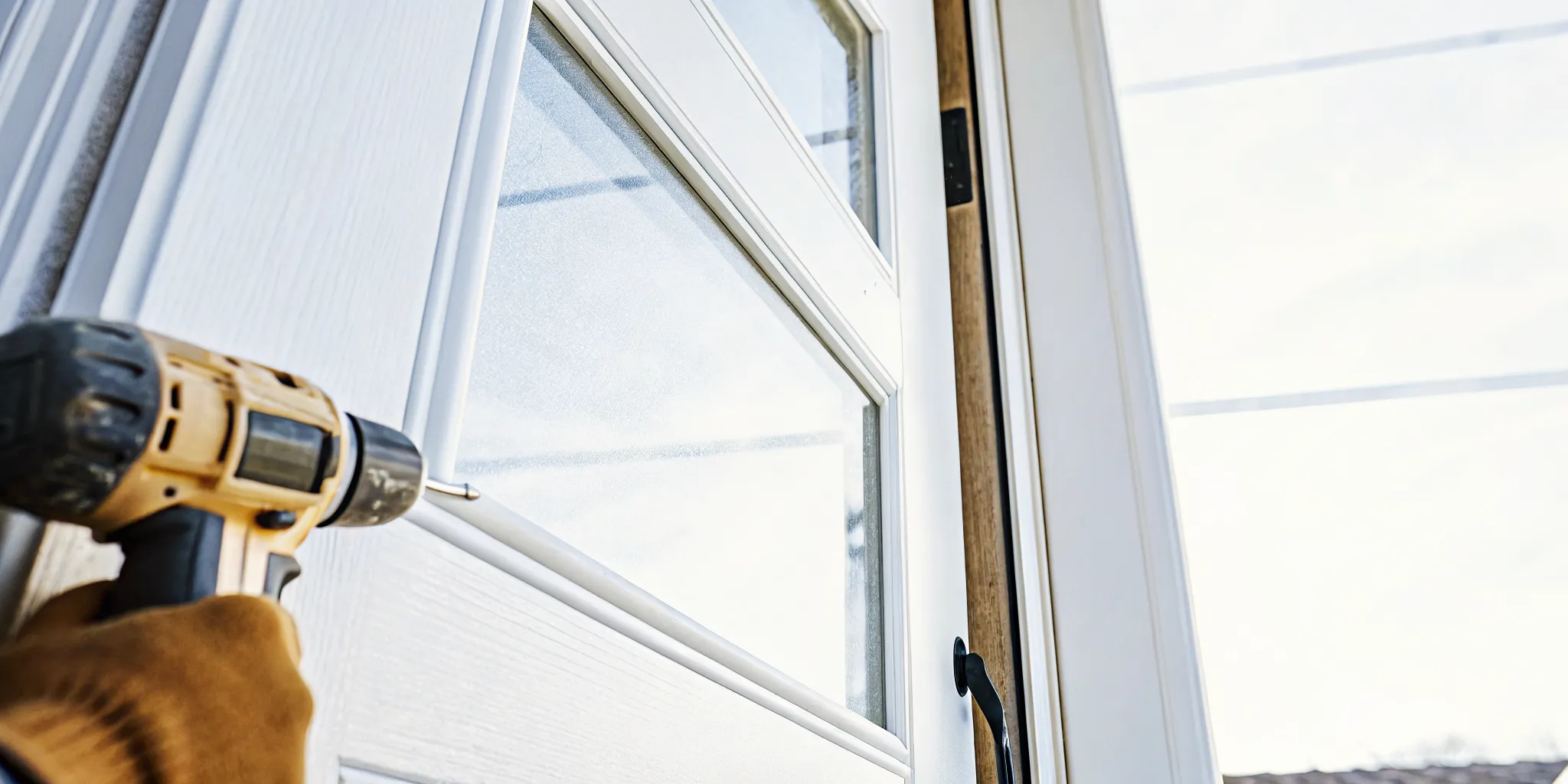 A beautiful custom front entry door being professionally installed on a suburban home in South Jersey